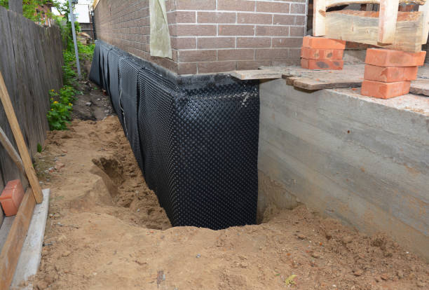 SJ Waterproofing Pros technician performing targeted Waterproofing assessment in Osceola, IN
